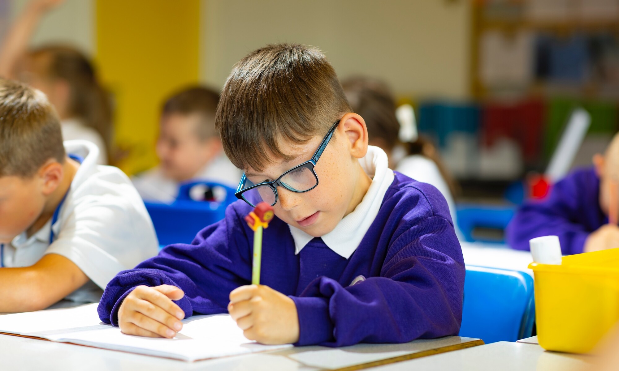 Peacehaven Heights Academy Image of pupil writing in a lesson